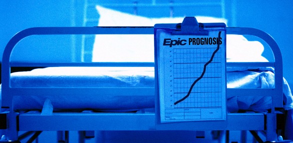 close-up of a patient chart at the foot of a hospital bed